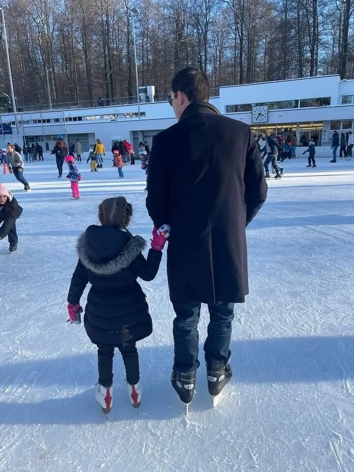 Josh ice skating with his family.