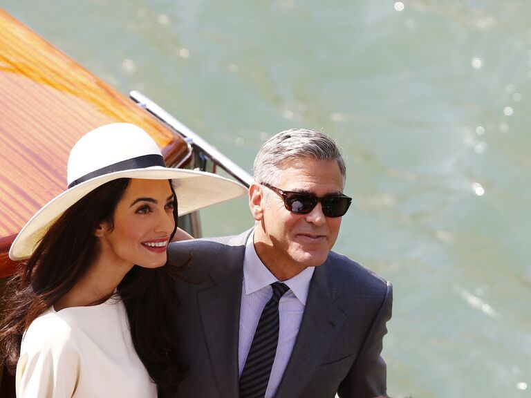 George and Amal Clooney on a boat in Venice on their wedding weekend