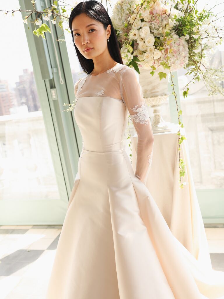 Sarah Seven  new wedding dresses, clean lines, strapless with sheer sleeves and lace applique