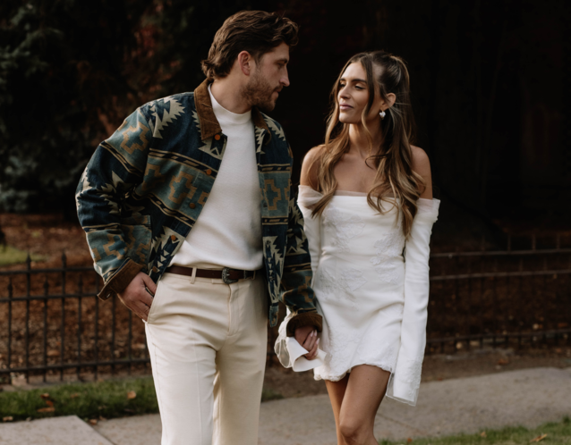 Couple looking at each other holding hands in the fall