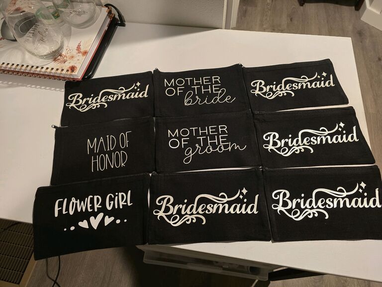 Somehow, Shelby convinces Joshua to join in finishing the makeup bags. Not only does he lend a hand, but he also designs a custom logo for the opposite side. This logo becomes a signature element of Shelby and Joshua’s DIY projects, adding a personal touch to many details throughout the wedding.