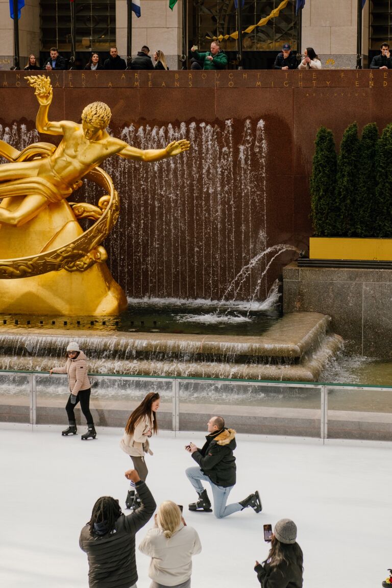 Brandon proposed to McKenna at Rockefeller Center in New York. He took her ice skating & fell on the ice like he had on their first date.. only this one was planned :) 