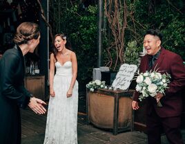 Photo from wedding ceremony with bride and wedding planner laughing