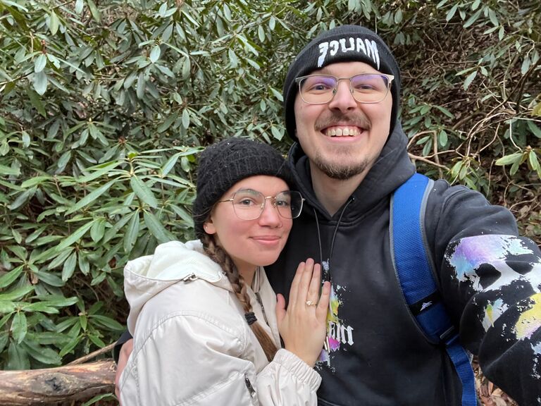 In December 2023 we went on vacation for our 5th anniversary. While hiking on Lovers Leep Loop Trail, Hot Springs, North Carolina Joseph proposed. I said yes immediately and it started snowing.  Neither of us had ever seen snowfall before that moment,  it was perfect. 