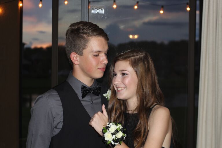 Us taking photos before our first hoco together!
