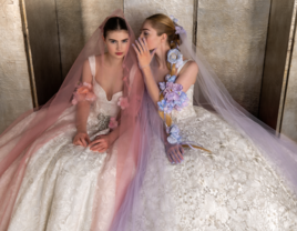 Two models wearing pastel bridal gowns at Bridal Fashion Week