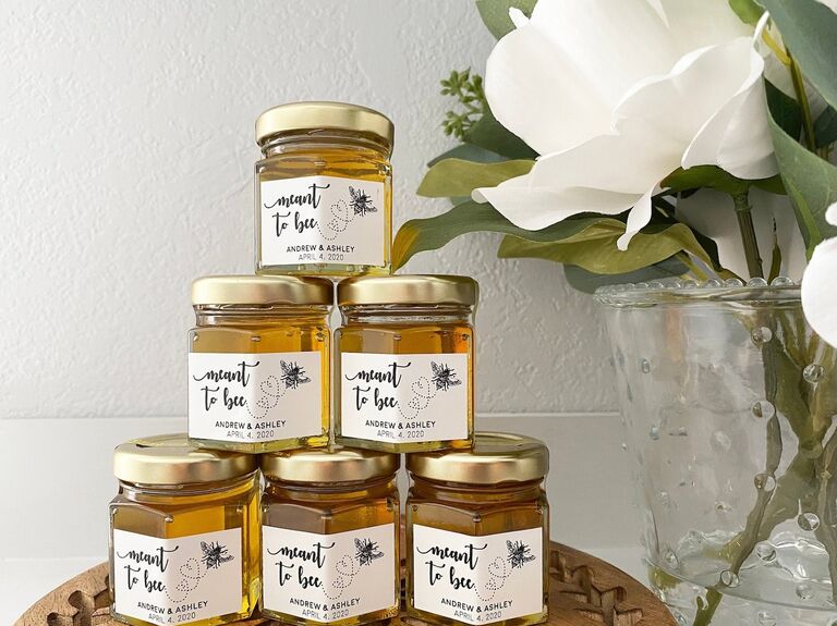 Honey jars with custom labels that read Meant To Bee bridal shower favors
