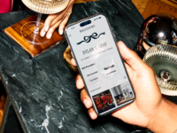 Phone showing couple's registry on The Knot