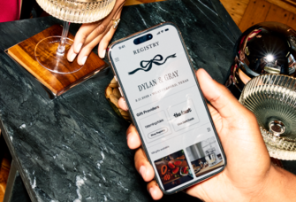 Phone showing couple's registry on The Knot