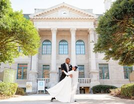 Couple posing outside the Historic DeKalb Courthouse