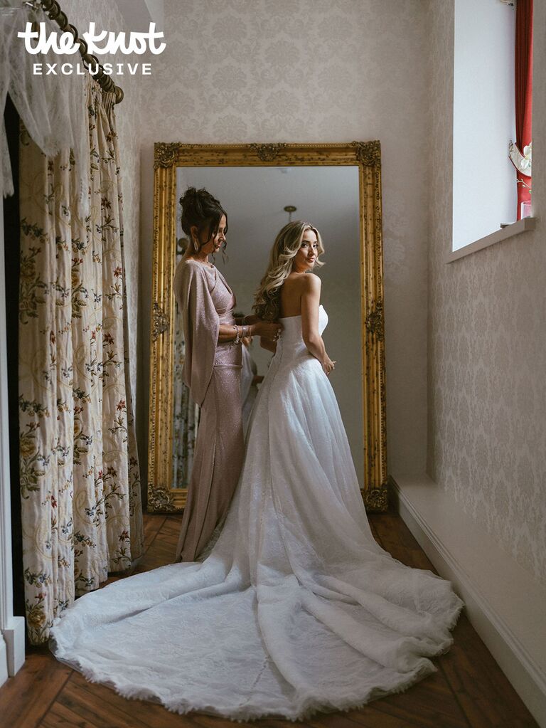 Logan Rae Hill getting into her wedding dress with her mom