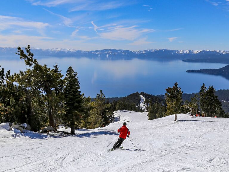 People skiing overlooking Lake Tahoe