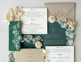 Green and neutral colored Indian wedding invitation suite. 