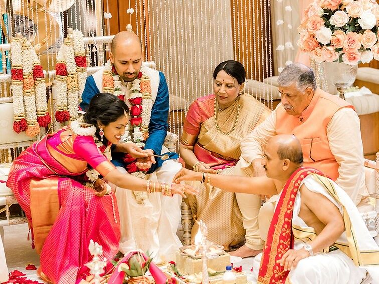 Couple with in laws during traditional ceremony