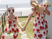 Mom and daughter wearing matching pink striped hydrangea mommy and me dresses from Pink Chicken