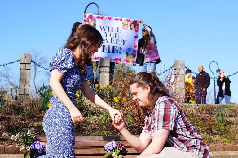 Can't forget THE MOMENT! Thank you to Jamie and Faith for fighting the wind to hold up the sign! 