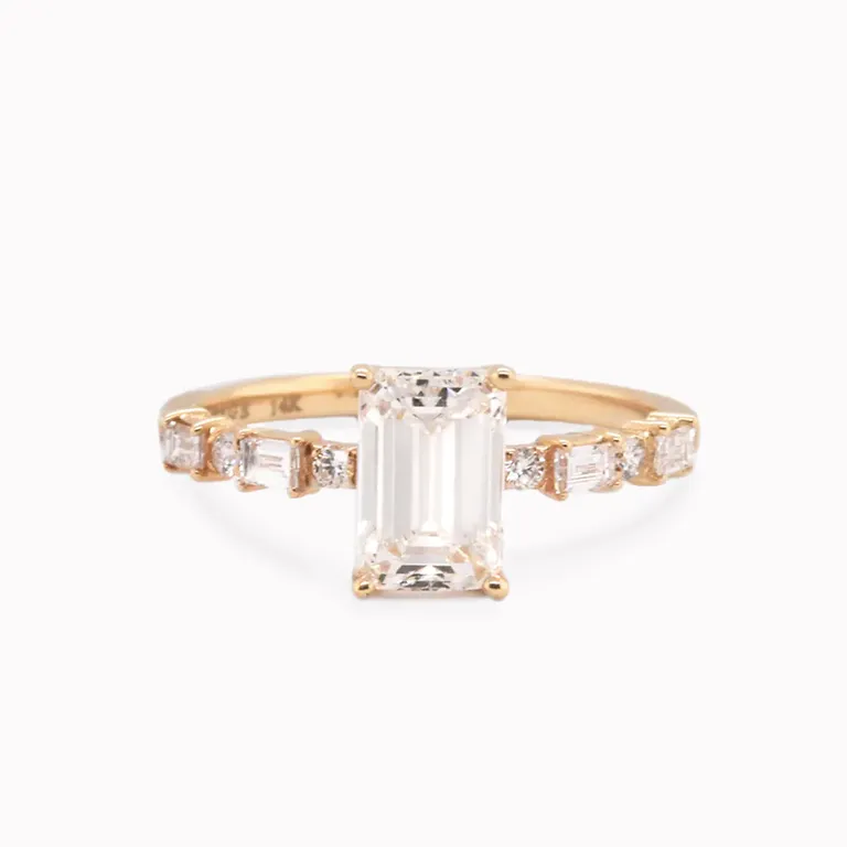 Emerald cut alternating round baguette diamond ring