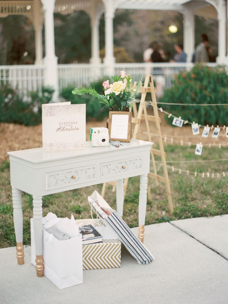 vintage table repurposed as wedding gift table with instant camera guest book