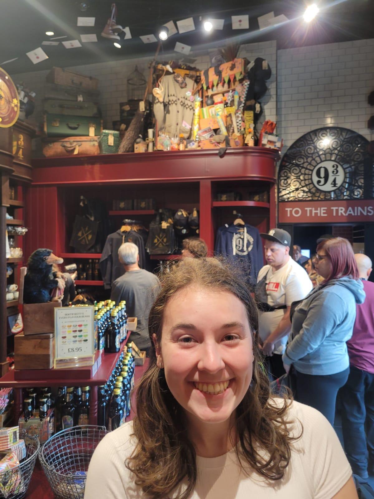 Kristen exploding with excitement at Platform 9 3/4