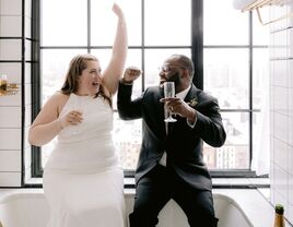 Couple toasting with champagne at microwedding