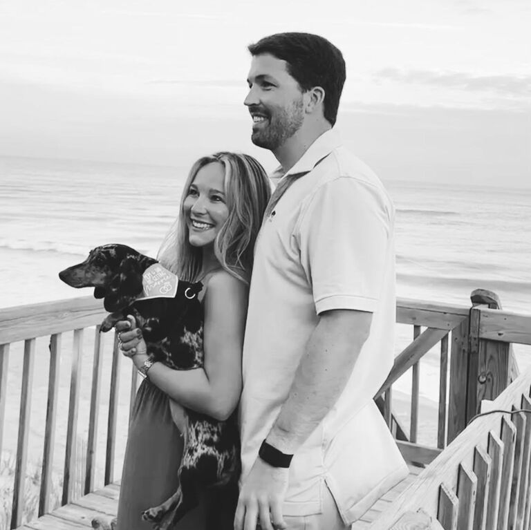 Friends & family surprised Megan shortly after the proposal & were cheering on the beach house deck! 