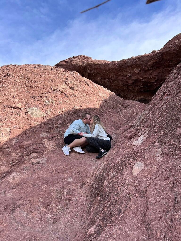 In December 2022, Shelby and Brian took a trip to Phoenix. One morning they decided to walk through "Hole in the Rock." While they were looking around, Brian proposed - it couldn't have been more perfect. After the wedding, they will be going to Phoenix for a short trip back to where it all began!