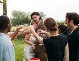 Friends and family toasting to bride and groom, cheap wedding ideas