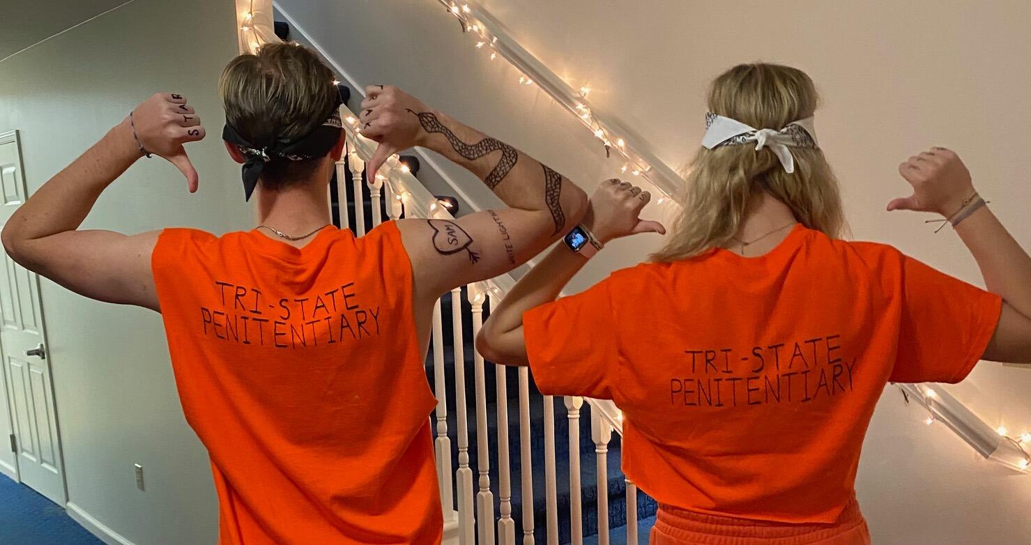 They dress up as inmates for their first Halloween (their favorite holiday). 