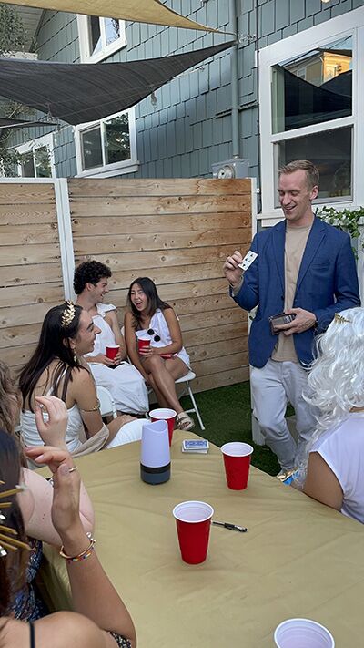 Magician at a backyard grad party