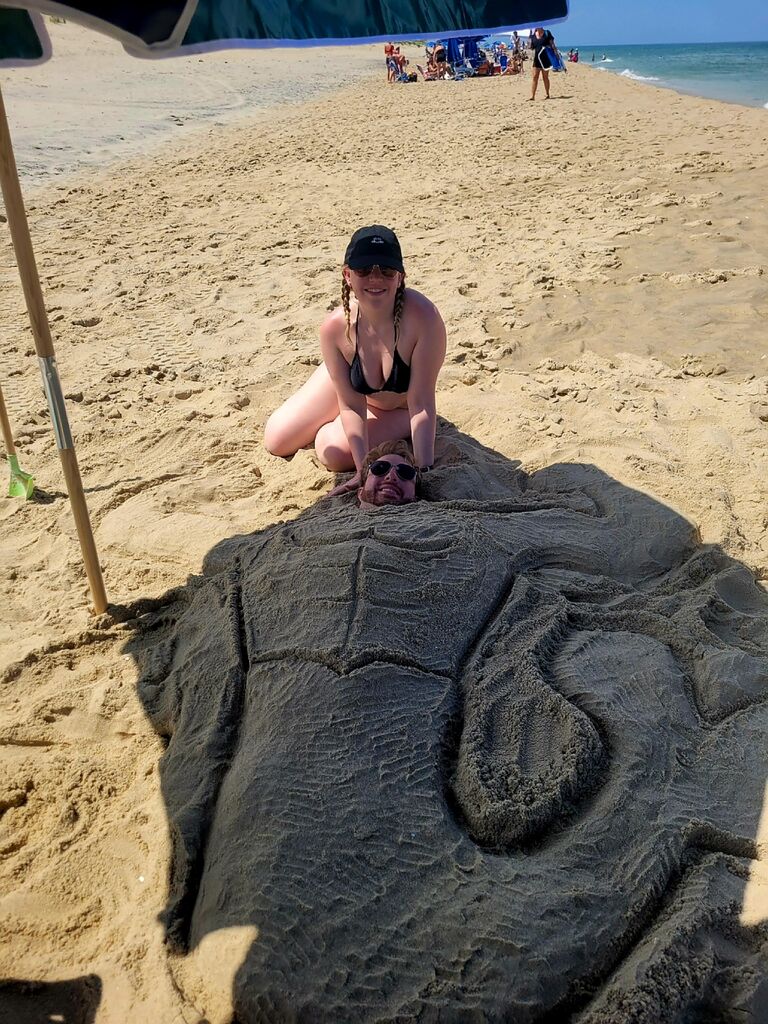 Burying Logan in the sand!