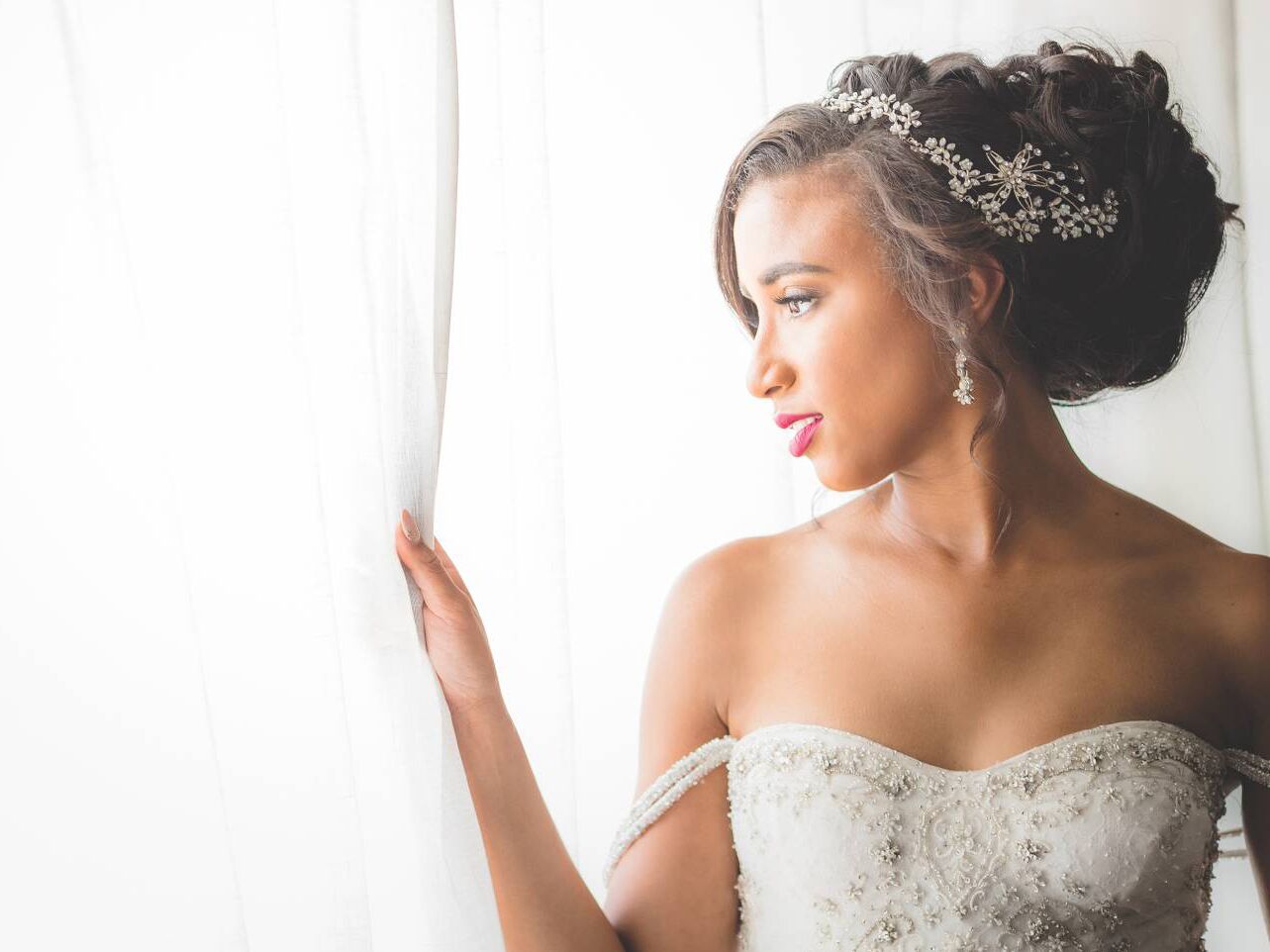 bride with romantic updo and headpiece