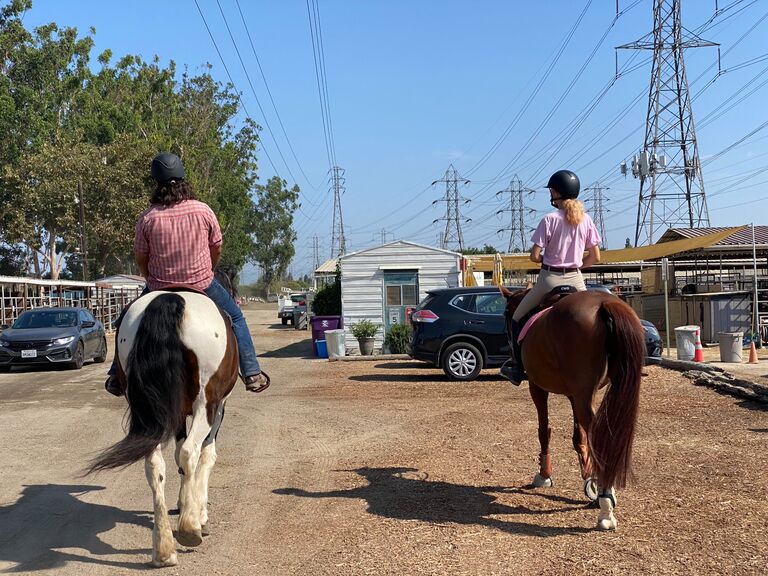 Julia was teaching a lesson to one of her students (on the right) and ran in to Justen who was exercising a horse for a friend. The matching pink shirts were laughed about for days! At this point Julia and Justen were barn friends.