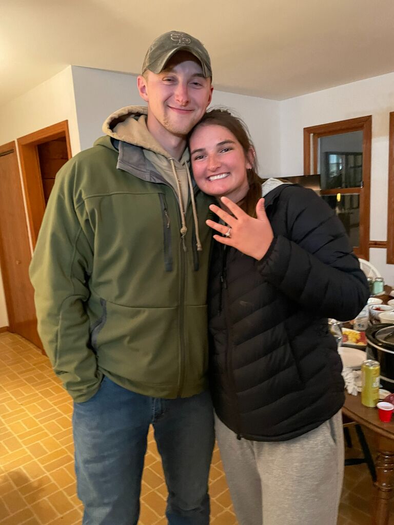 The day we were engaged! I completed a college internship in Steamboat Springs, CO and  Nate flew out to drive back with me. His original plan was to ask me to marry him at a scenic spot in Colorado that was special to me.  Lots of travel snags made that difficult to pull off, so the engagement happened back in Wisconsin. Nate had to do LOTS of text messaging with family to arrange for the new plan without me catching on. He successfully handed the engagement ring off to our future sister-in-law who raced to Nate's parent's house to tie the ring around our dog Oakley's neck.  I was greeted at home by our sweet pup and a very special surprise!