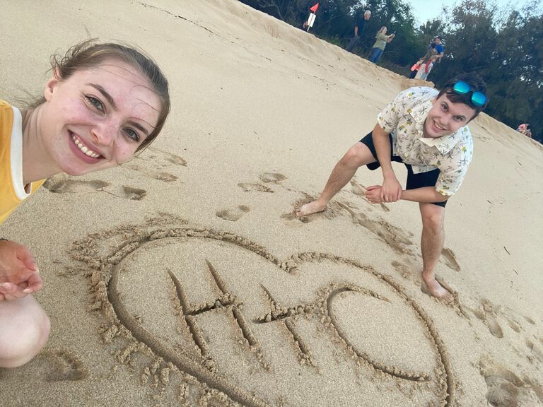 Haley and Connor's second trip to Hawaii. They write their initials in the sand.