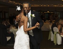 Father and daughter sharing dance at wedding