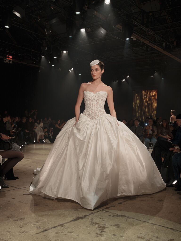 Ines Di Santo strapless wedding dress with lace bodice and full satin skirt and pill box hat