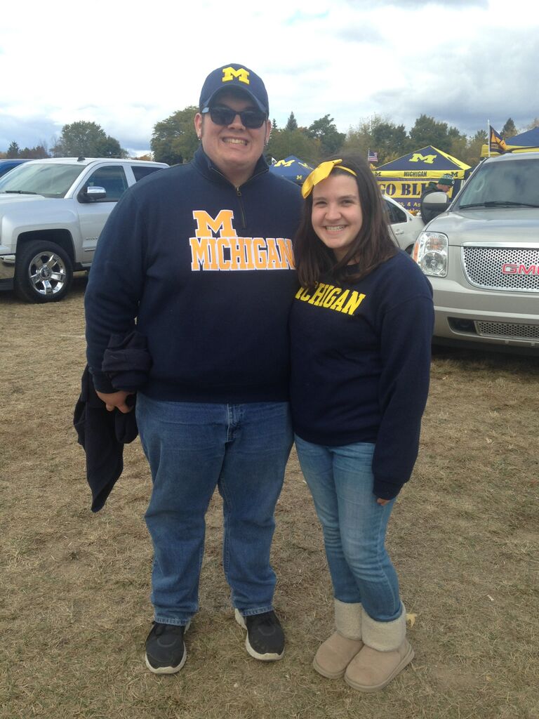 Emily & Erik attend the U of M/MSU football game courtesy of Emily's sister, Stephanie. They don't talk about that game though...