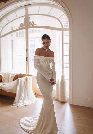 Attika — cold-shoulder long sleeve dress with slight side-wrapped silhouette and elongated trail.