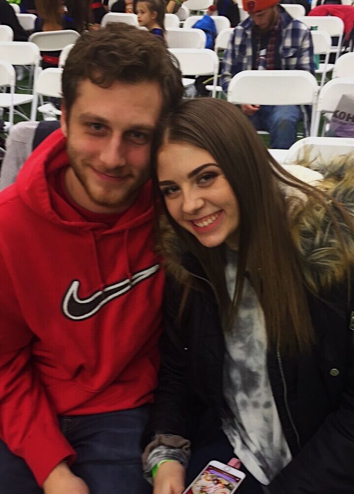 Our first photo together at a cheerleading competition at the Bill's training facility. 
