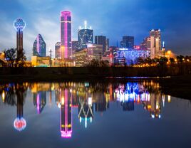 dallas bachelor party photo of city skyline brightly reflected in water