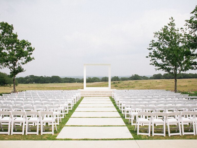 Wedding ceremony with modern white square altar arch