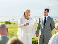 Mother of the groom giving speech during wedding reception.