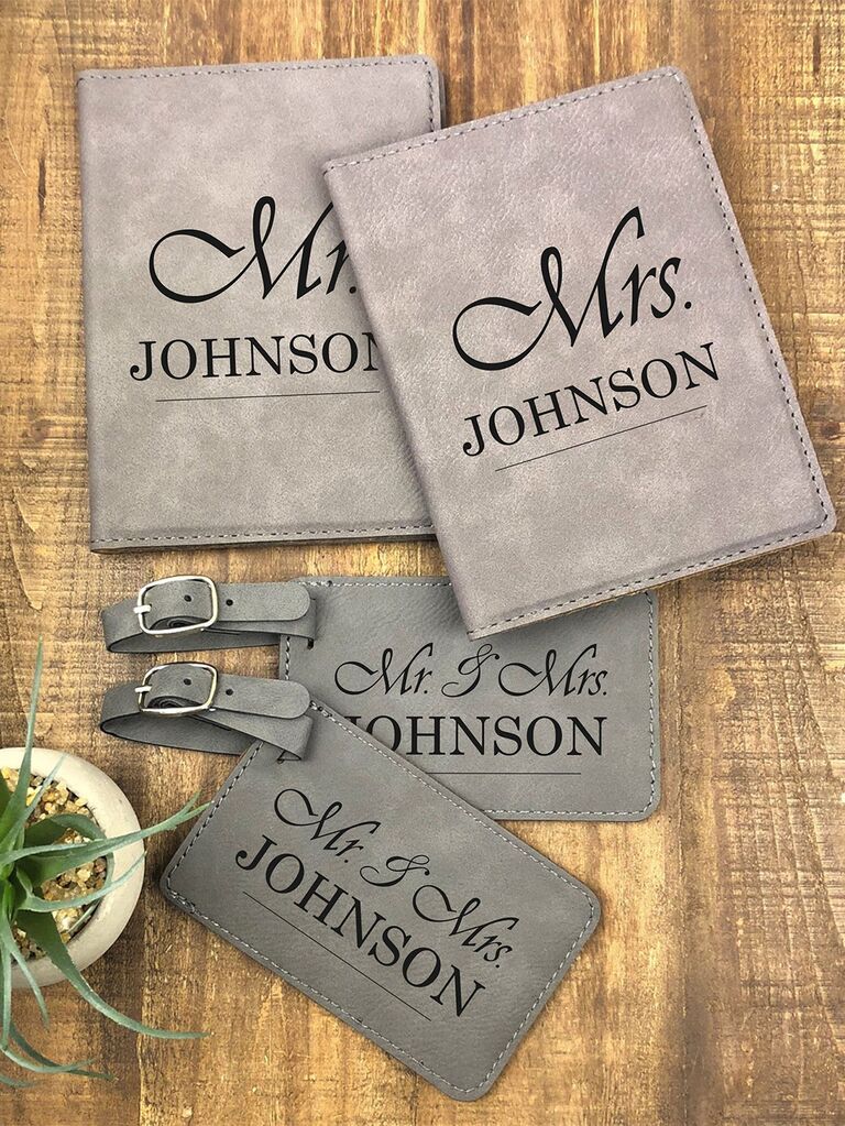Gray tags and passport books with couple's names in black type