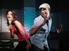 Couple performing a duet karaoke song