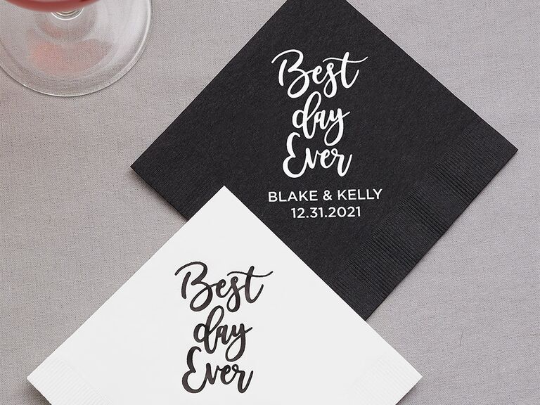 Black and white napkins with 'Best day ever' in loopy script and couple's names and date below