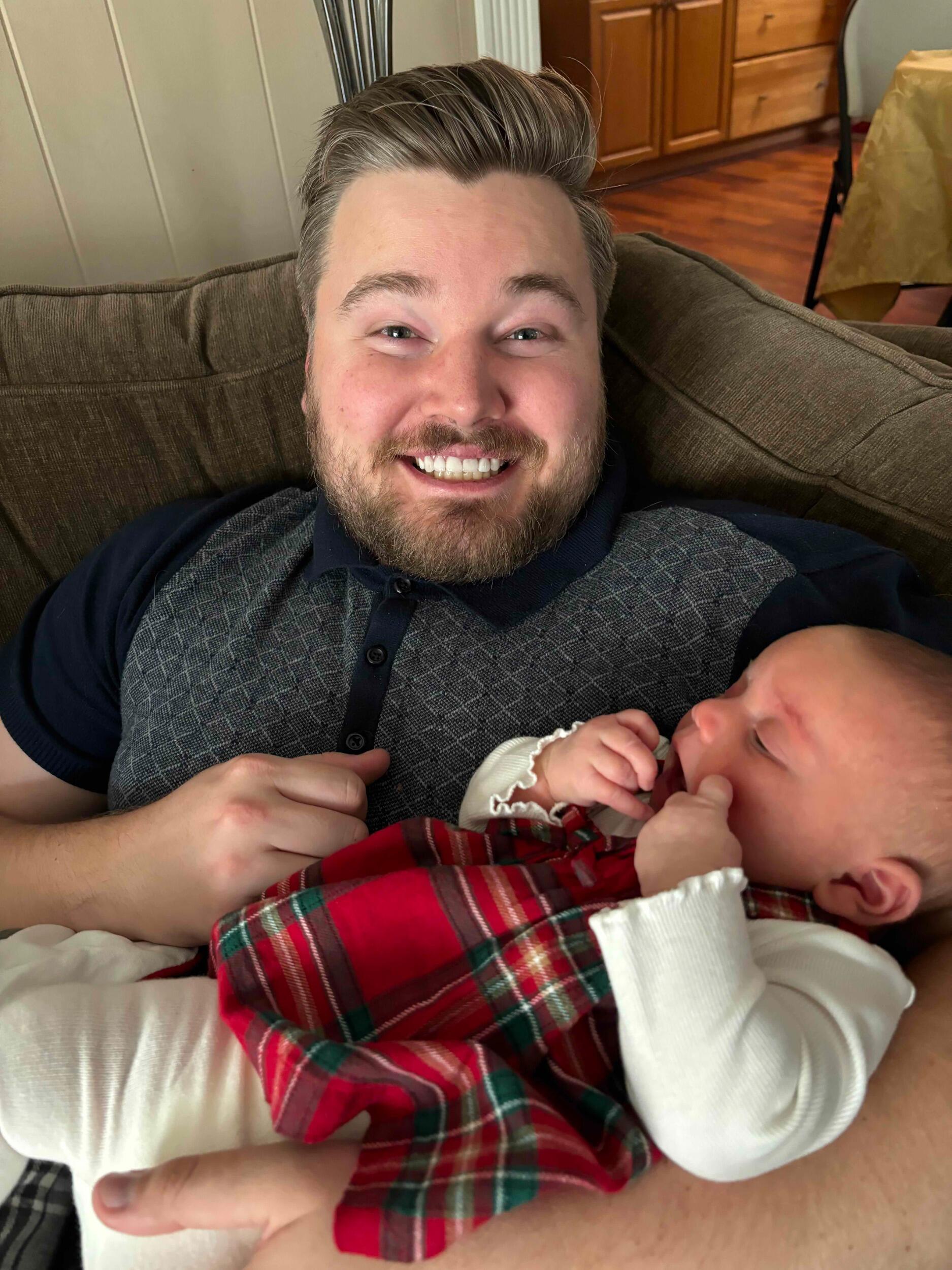 Uncle Kyle holding baby G. He really is a natural with kids lol. 