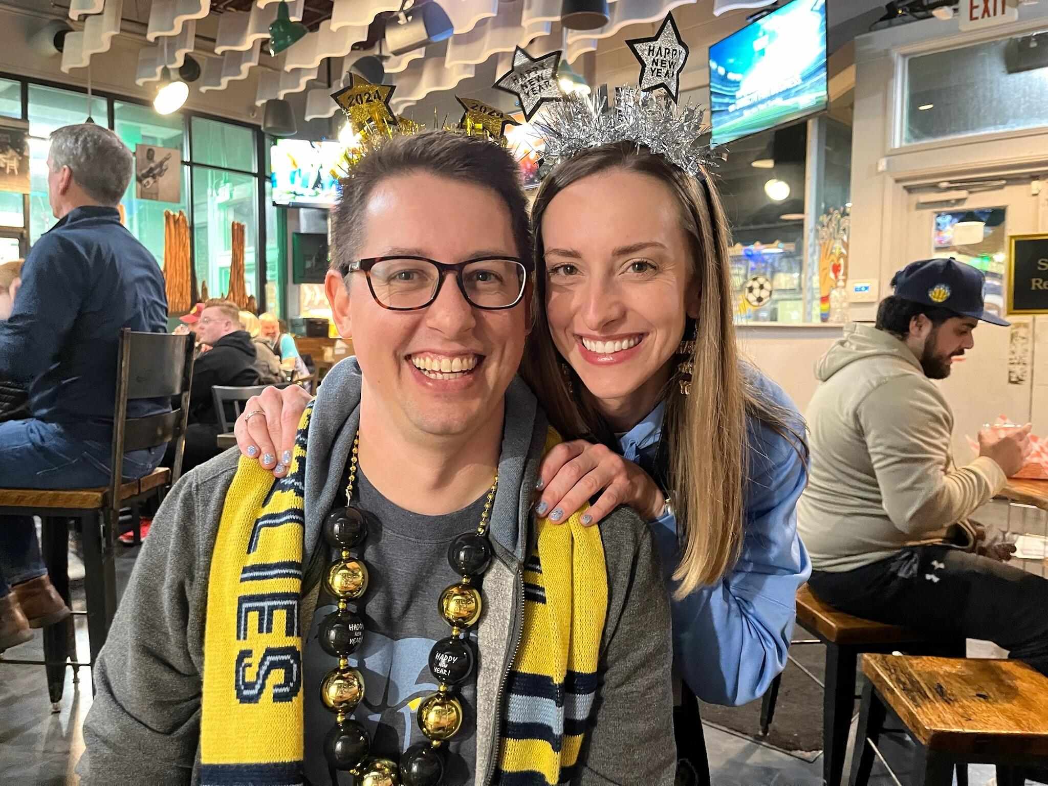 Kirsten and Tyler spend New Year's Eve together for the first time since the 2010-into-2011 NYE (peep the photo recreation), attending the NYE Grizzlies game with Mallory. Tyler notices that Ghost River Brewing, where Kirsten and Mallory go before Grizzlies games often, is a Green Bay Packers bar, and he is excited to have found a Packer bar in Memphis!