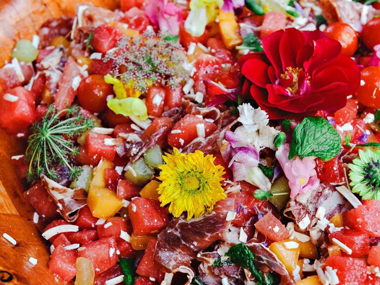 Family-style salad with edible flowers and herbs