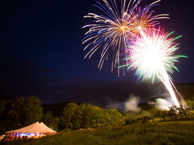 Fireworks over tented wedding reception