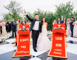 Couple walking into reception on wedding day 